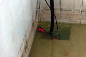 overflowing sump pump in basement