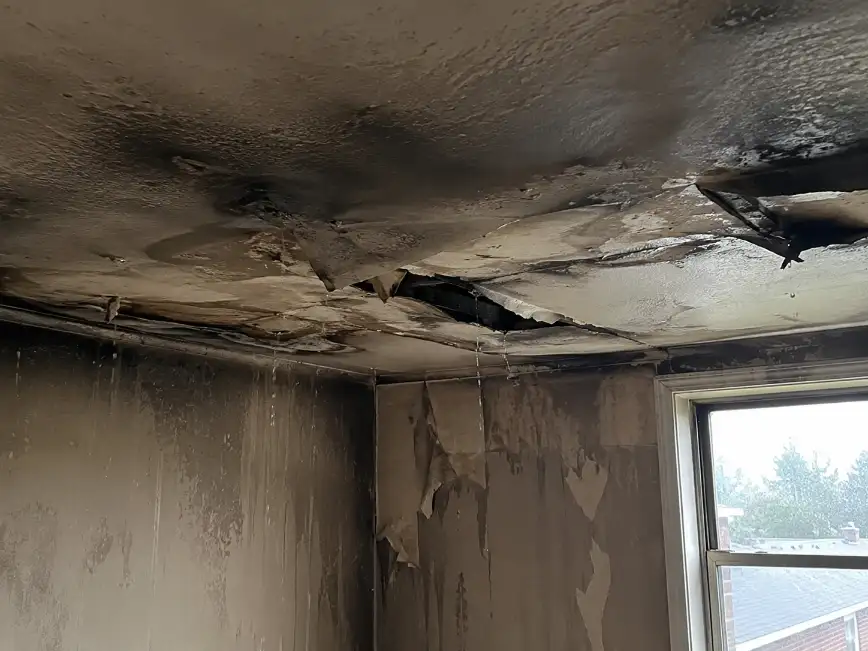 Sagging ceiling damaged by firefighting water after a house fire