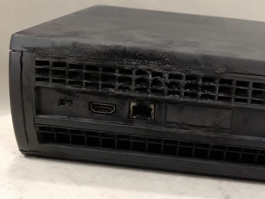 Soot damage around the vents and connection ports of an electronic device