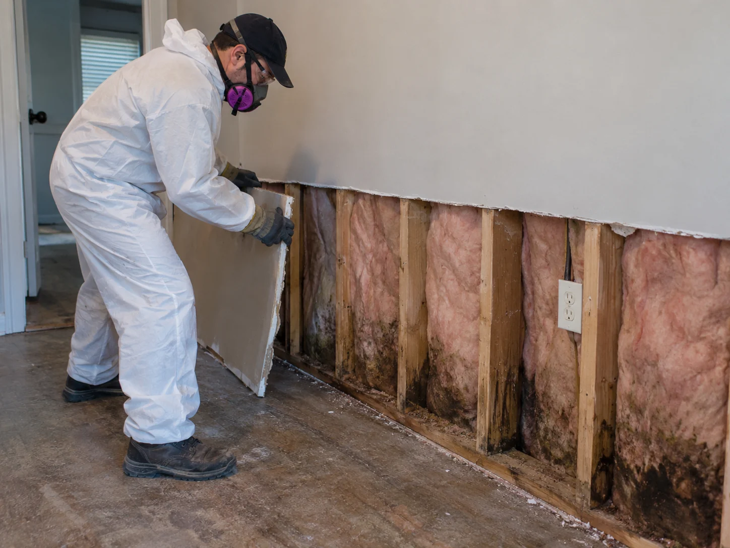 Professional removal of sewage-damaged drywall after a backup